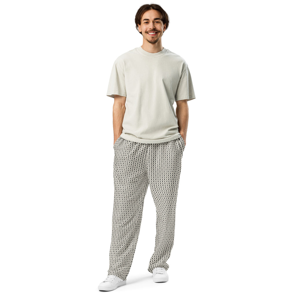 Model wearing the black-and-ivory keffiyeh-inspired wide-leg sweatpants