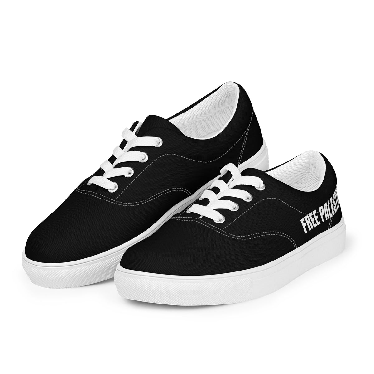 Black Free Palestine sneakers with bold white slogan, angled view