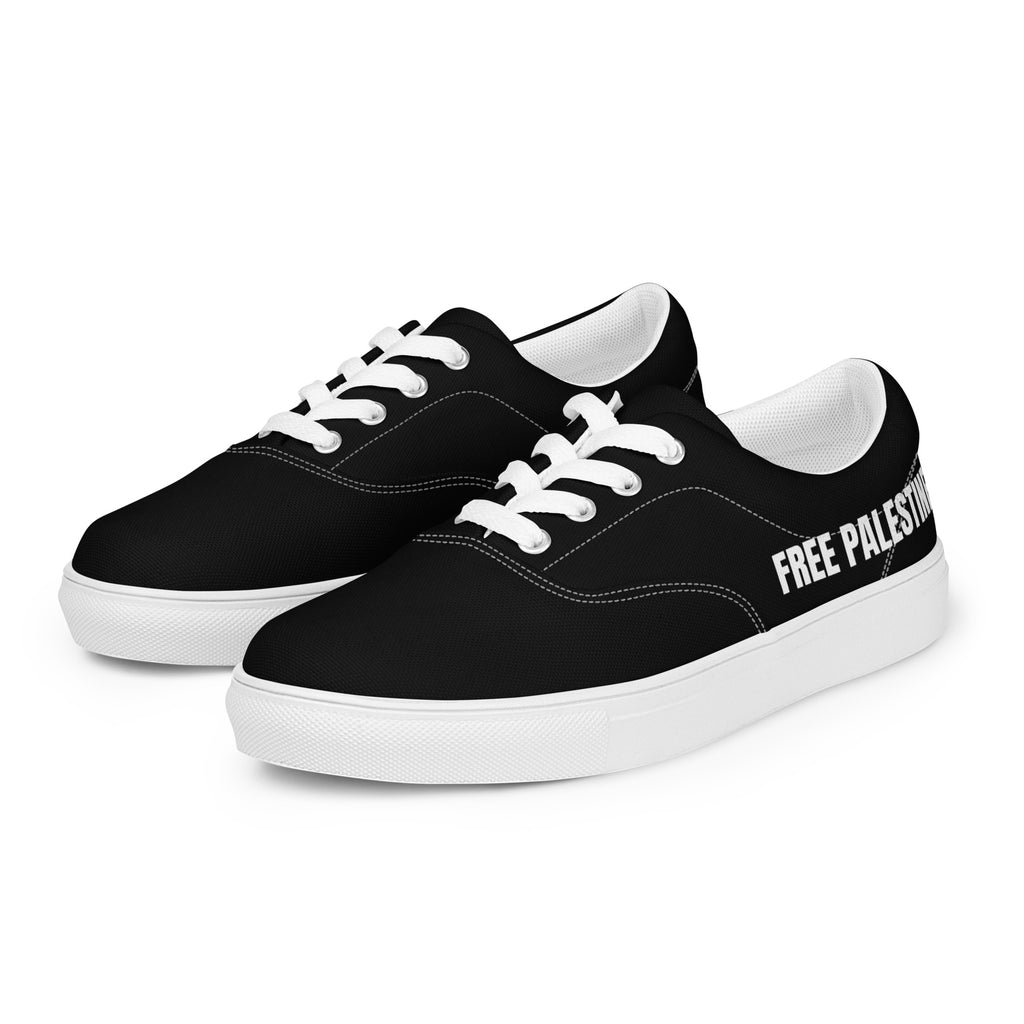 Black Free Palestine sneakers with large bold white lettering, side view